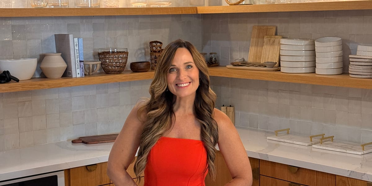 Couple touring a home with Deanna Hill, Hillside Realty